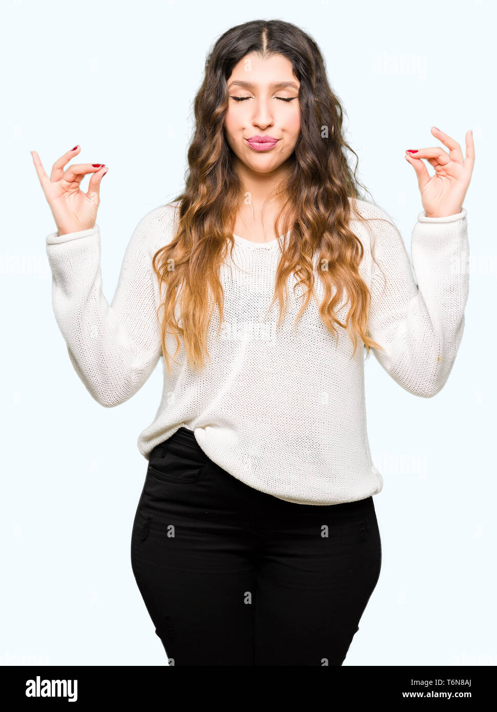 Young beautiful woman wearing white sweater relax and smiling with eyes ...