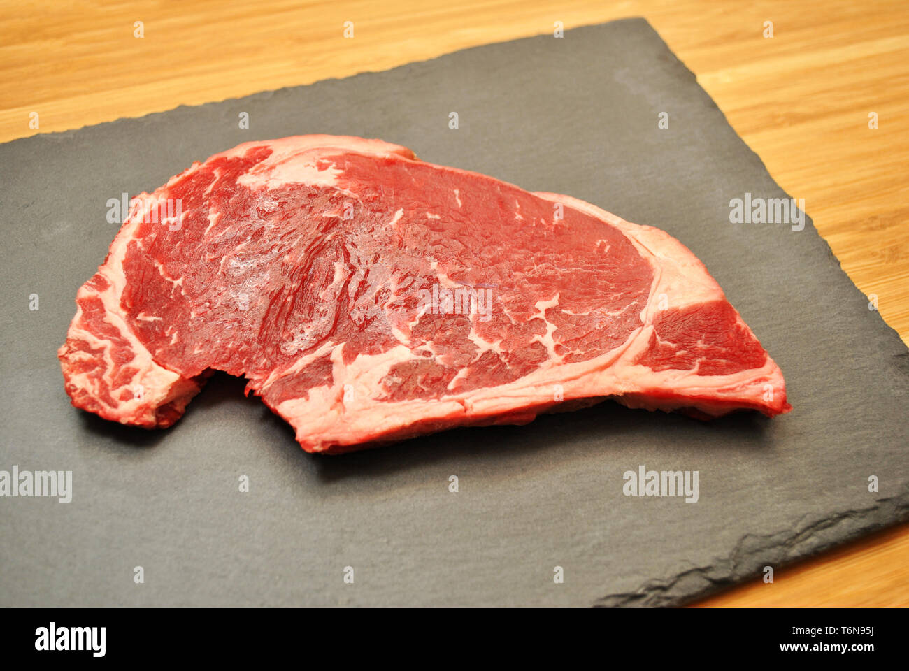 Prime Rib Steak on a Slate Board Stock Photo