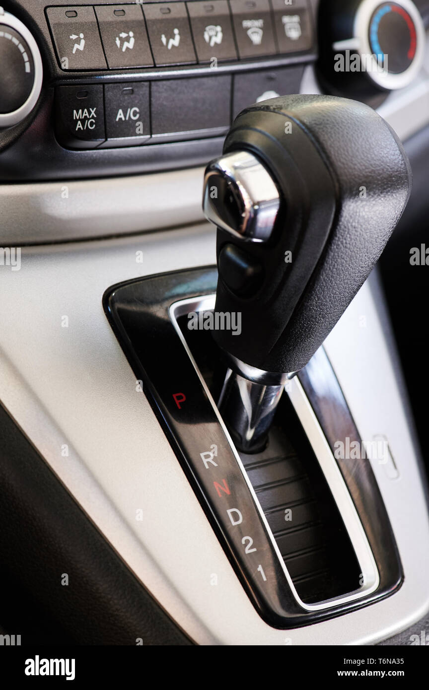 Automatic car gearbox stick on dashboard panel background Stock Photo