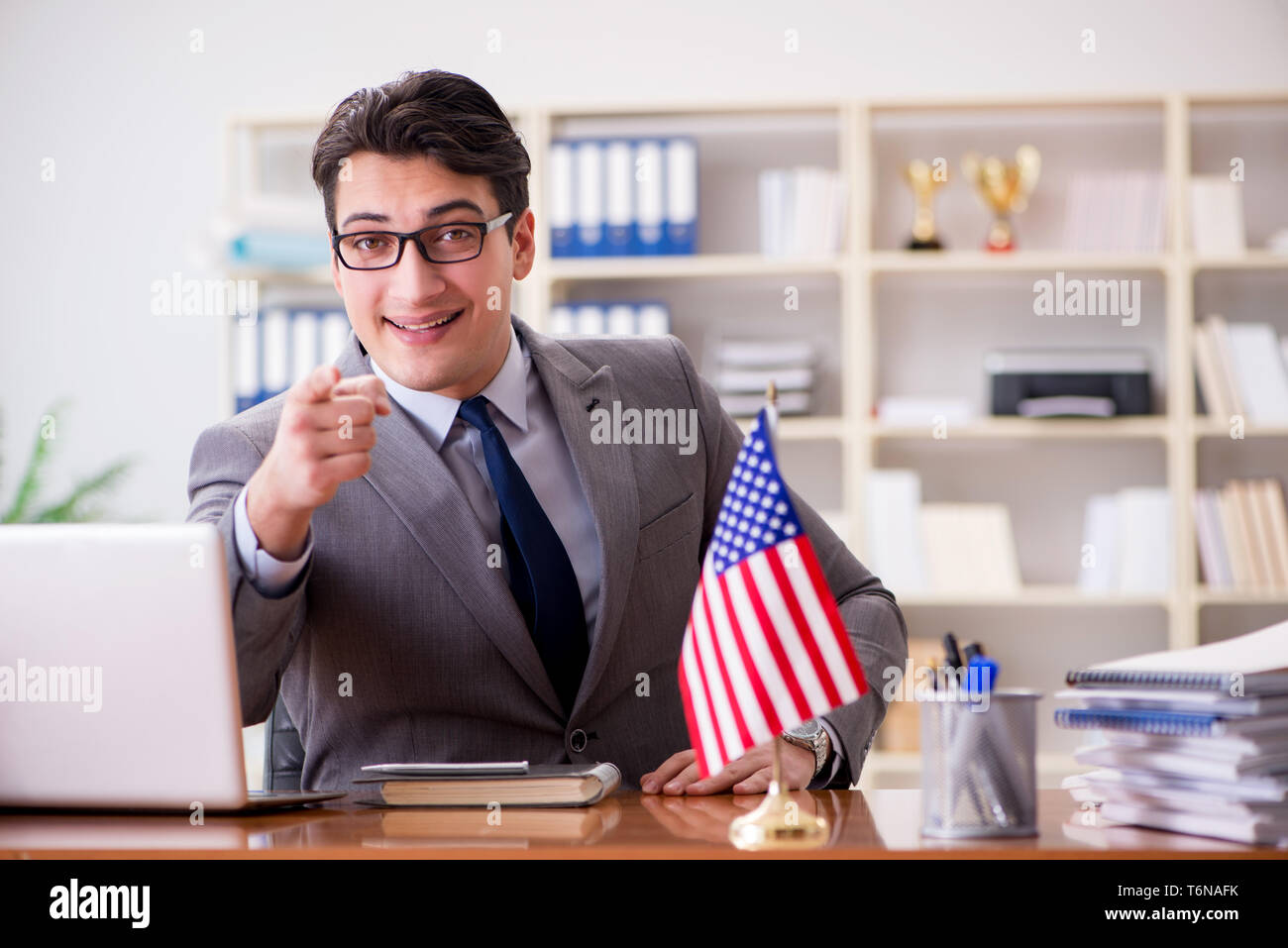 The businessman with american flag in office Stock Photo - Alamy