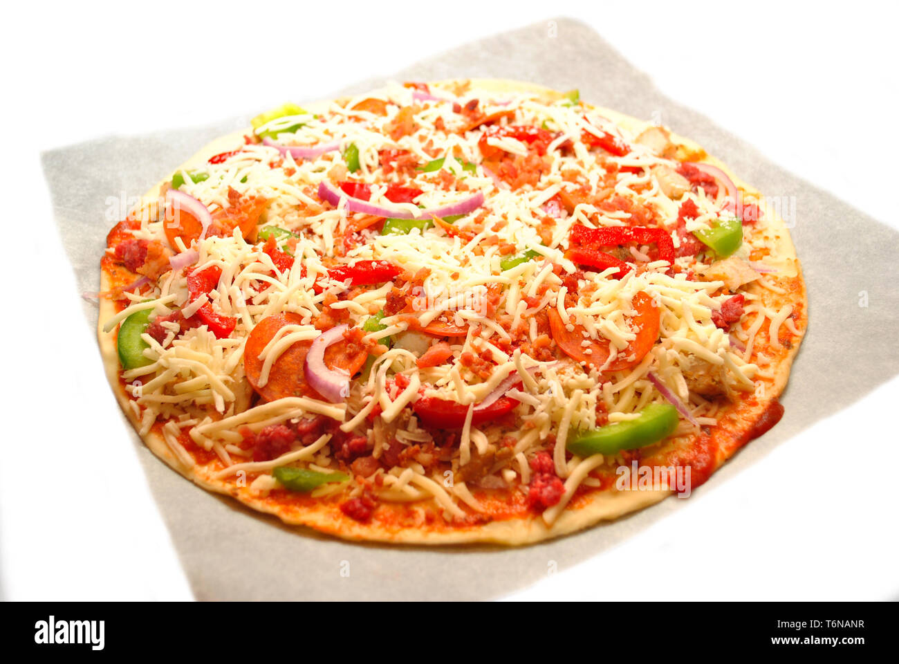 Raw Pizza on Parchment Paper Ready To Go Into the Oven Stock Photo Alamy