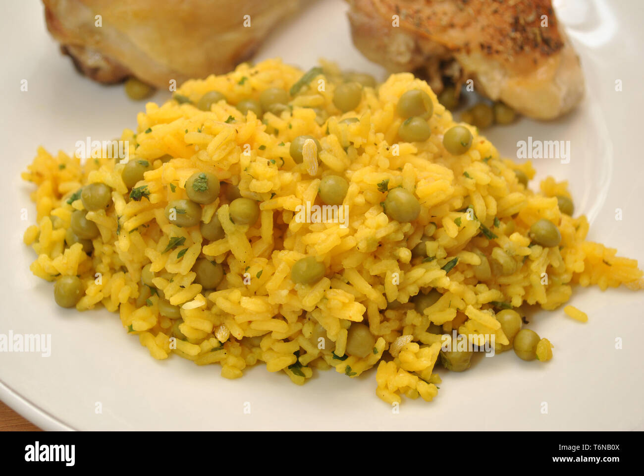 Rice & Peas Served with Crispy Baked Chicken Stock Photo Alamy
