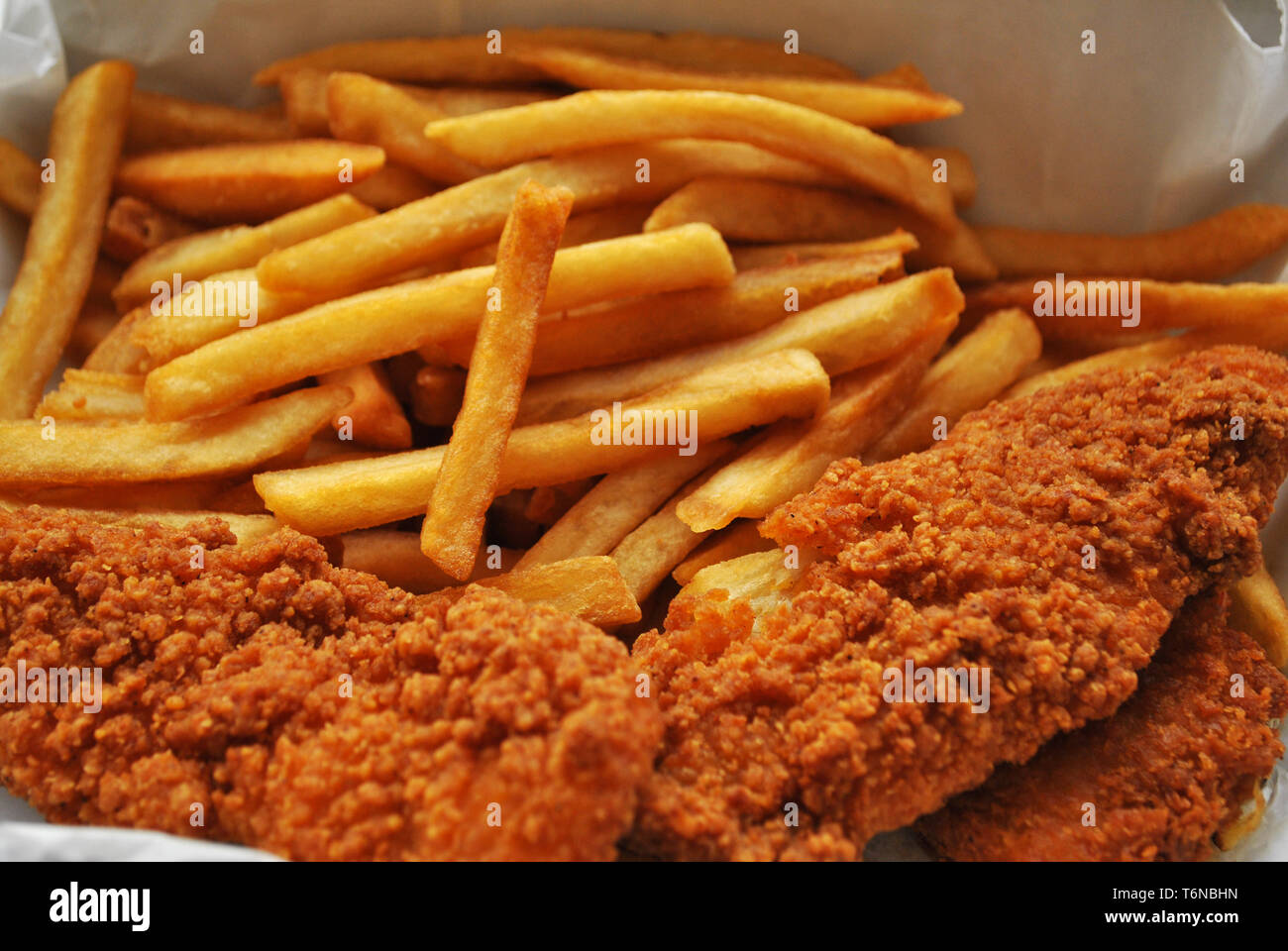 Fried Seafood Dinner in a Takeout Box Stock Photo