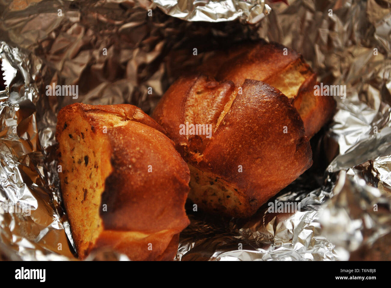 Garlic Bread in Foil Stock Photo Alamy