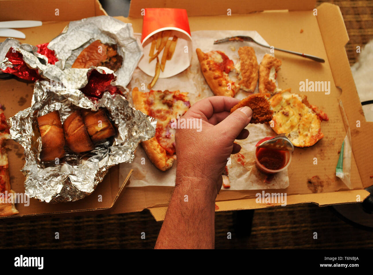 Eating Takeout Junk Food Stock Photo