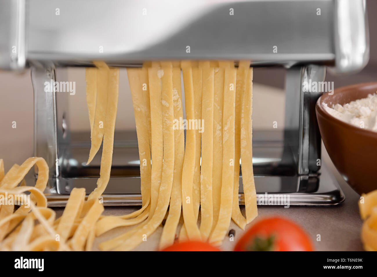 Making of tagliatelle with pasta machine Stock Photo Alamy