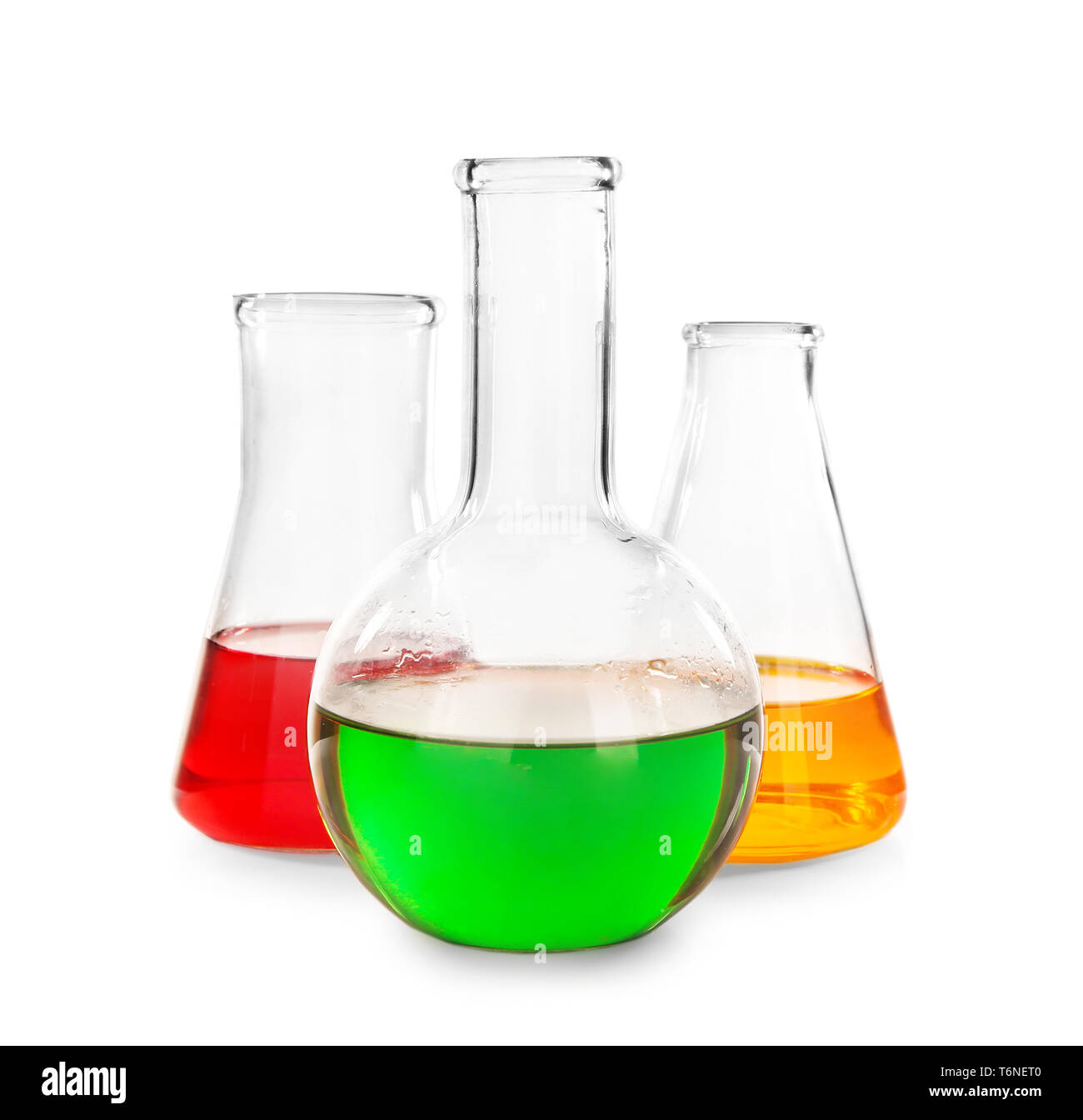 Laboratory glassware with liquids on white background Stock Photo - Alamy