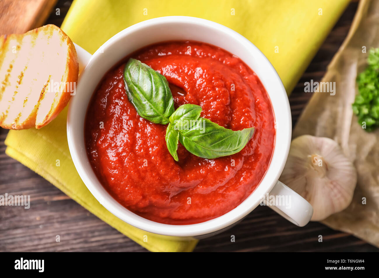 Tureen with tasty tomato sauce on table, top view Stock Photo