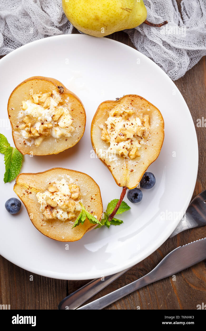 Pear with ricotta cheese, honey and cinnamon Stock Photo Alamy
