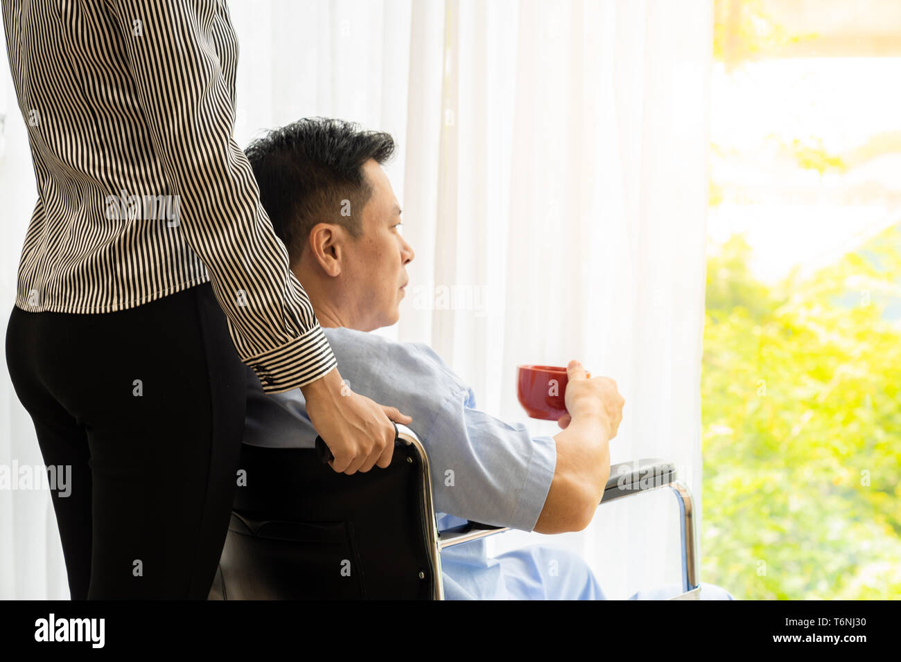 Elderly person in wheelchair hi-res stock photography and images - Alamy