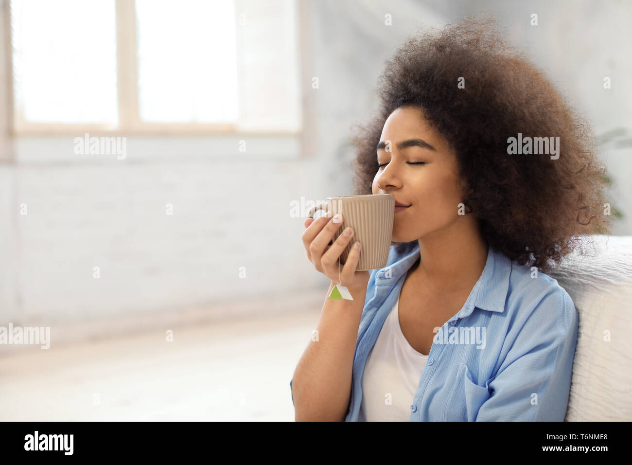 African american woman drinking tea hi-res stock photography and images ...