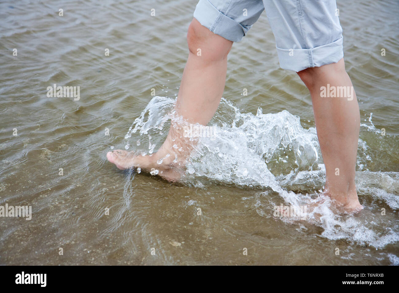 Barefoot Woman Walking Through Water High Resolution Stock Photography ...