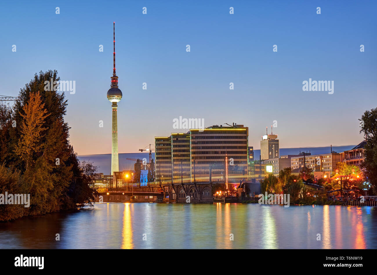 Dusk at the river Spree in Berlin with the famous Television Tower in the back Stock Photo