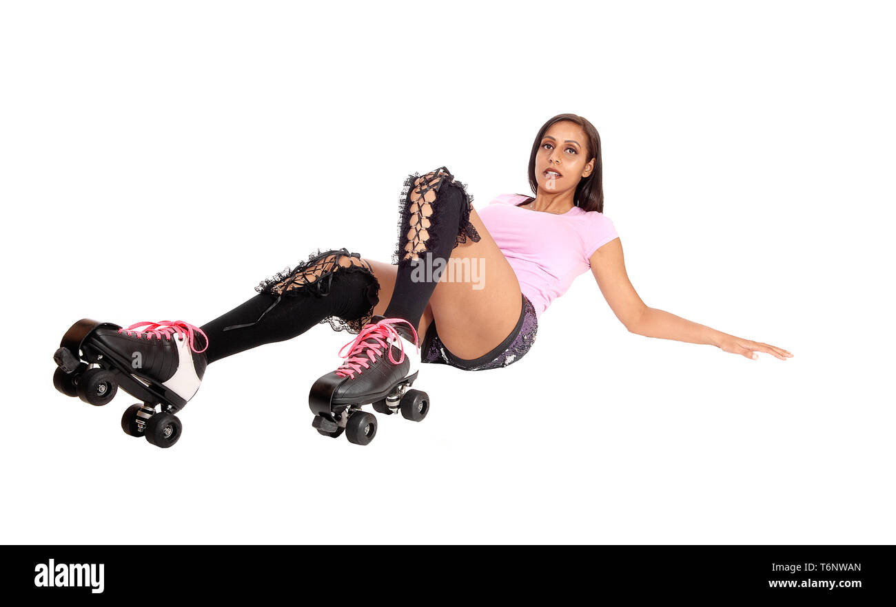 Roller skating woman lying on floor Stock Photo