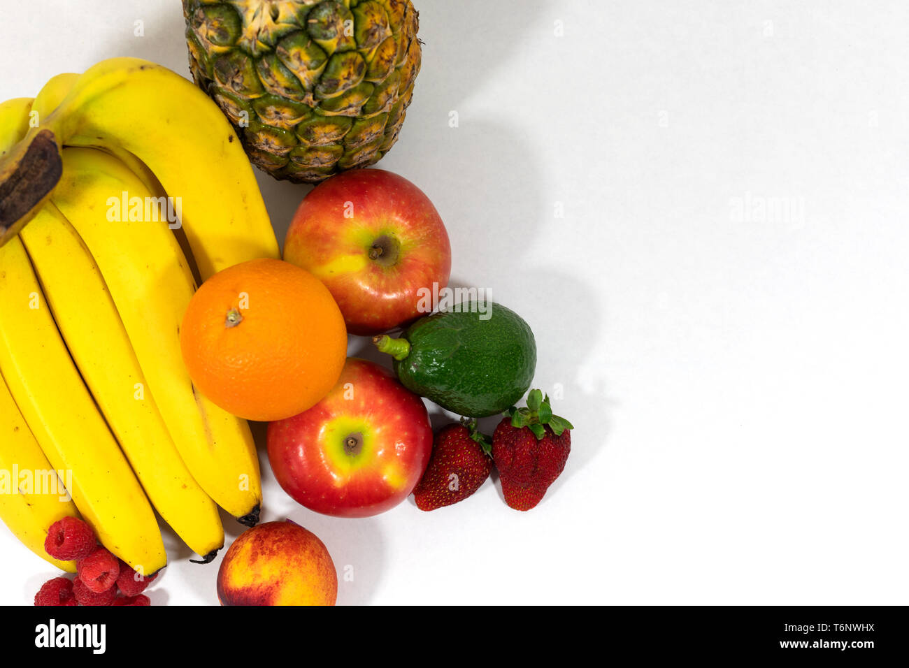 Arranged assortment of fresh, organic fruits. Vegan and clean eating lifestyles, promoting health and wellbeing, Vitamins and weight loss Stock Photo