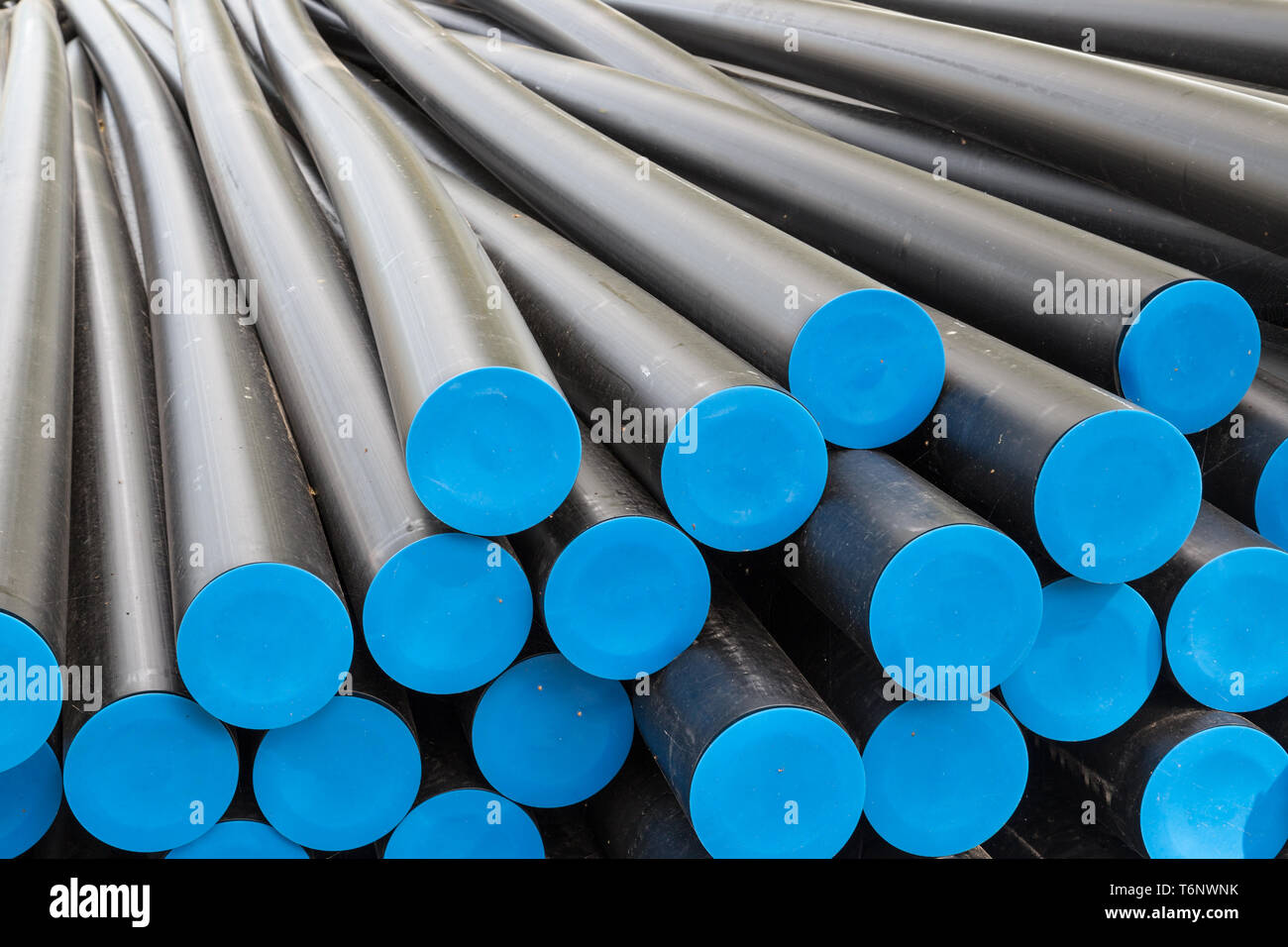 Big plastic tubes before electricty cables Stock Photo