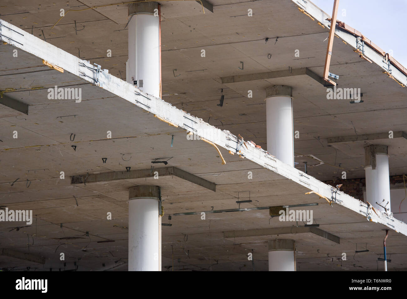 Demolition of a building with concrete floors and pillars Stock Photo