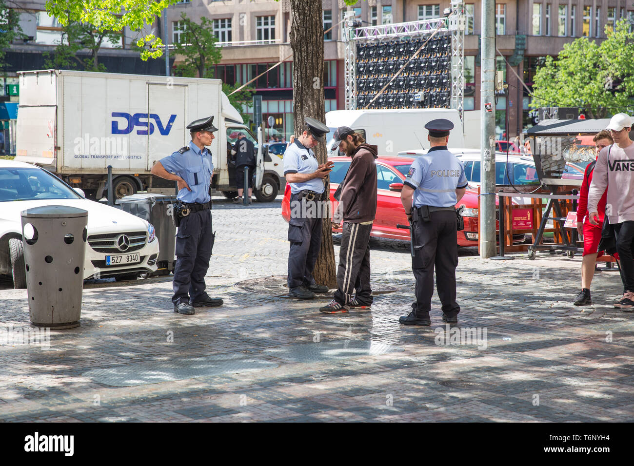 City Prague, Czech Republic. The city police are standing on the street and talking to the passerby. 2019. 25. April. Travel photo. Stock Photo