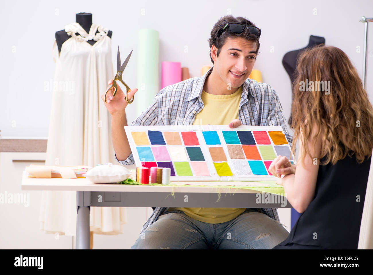 Young tailor working in his workshop Stock Photo - Alamy