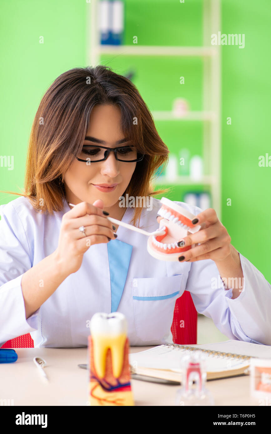 Woman dentist working on teeth implant Stock Photo Alamy