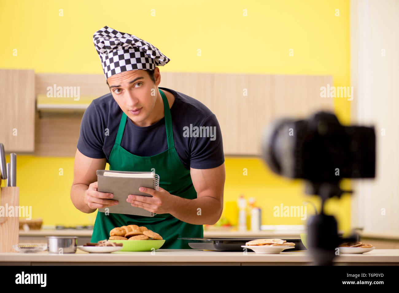 Young chef blogger explaining food preparation Stock Photo