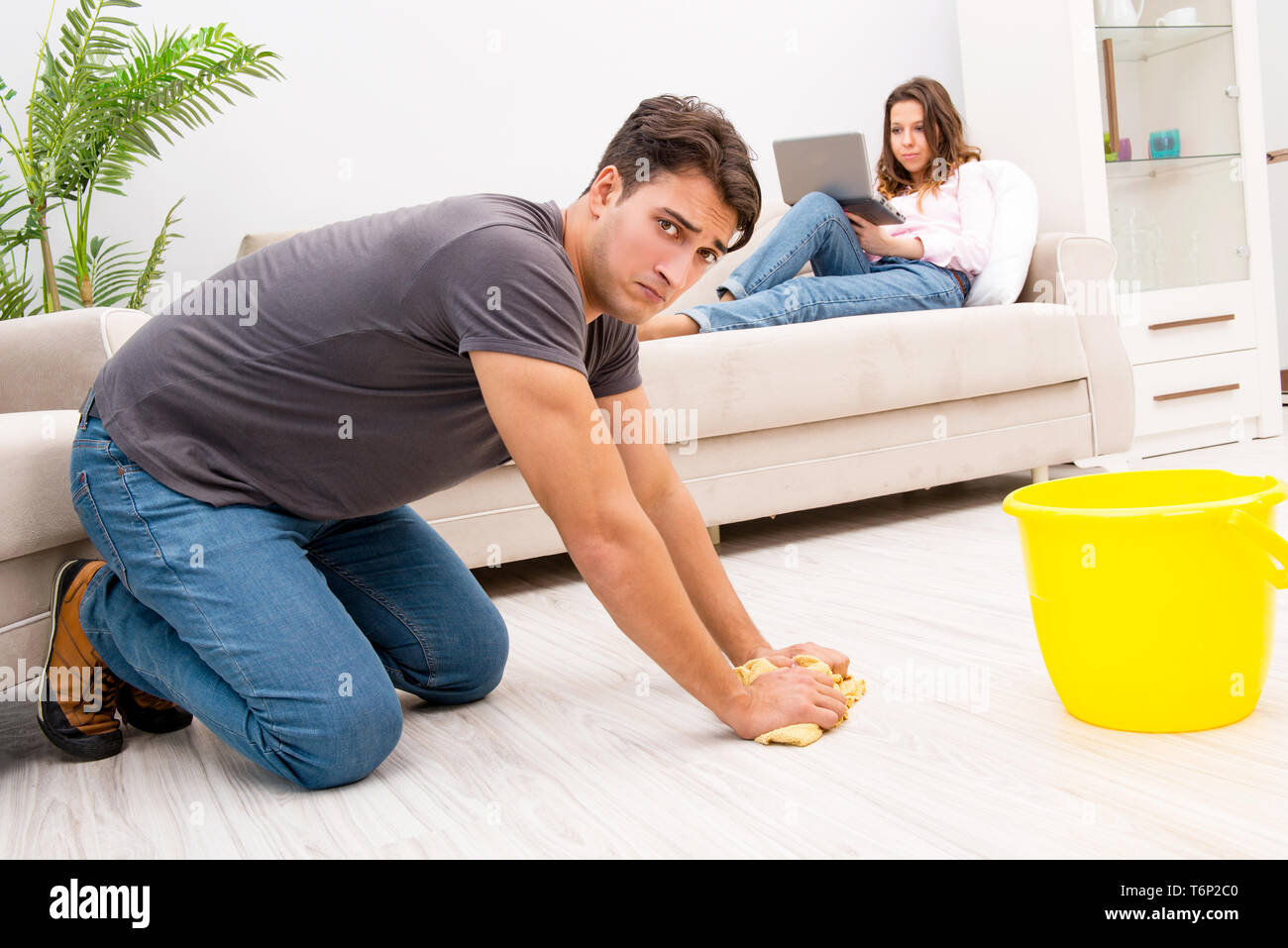 Man frustrated woman cleaning hi-res stock photography and images - Alamy