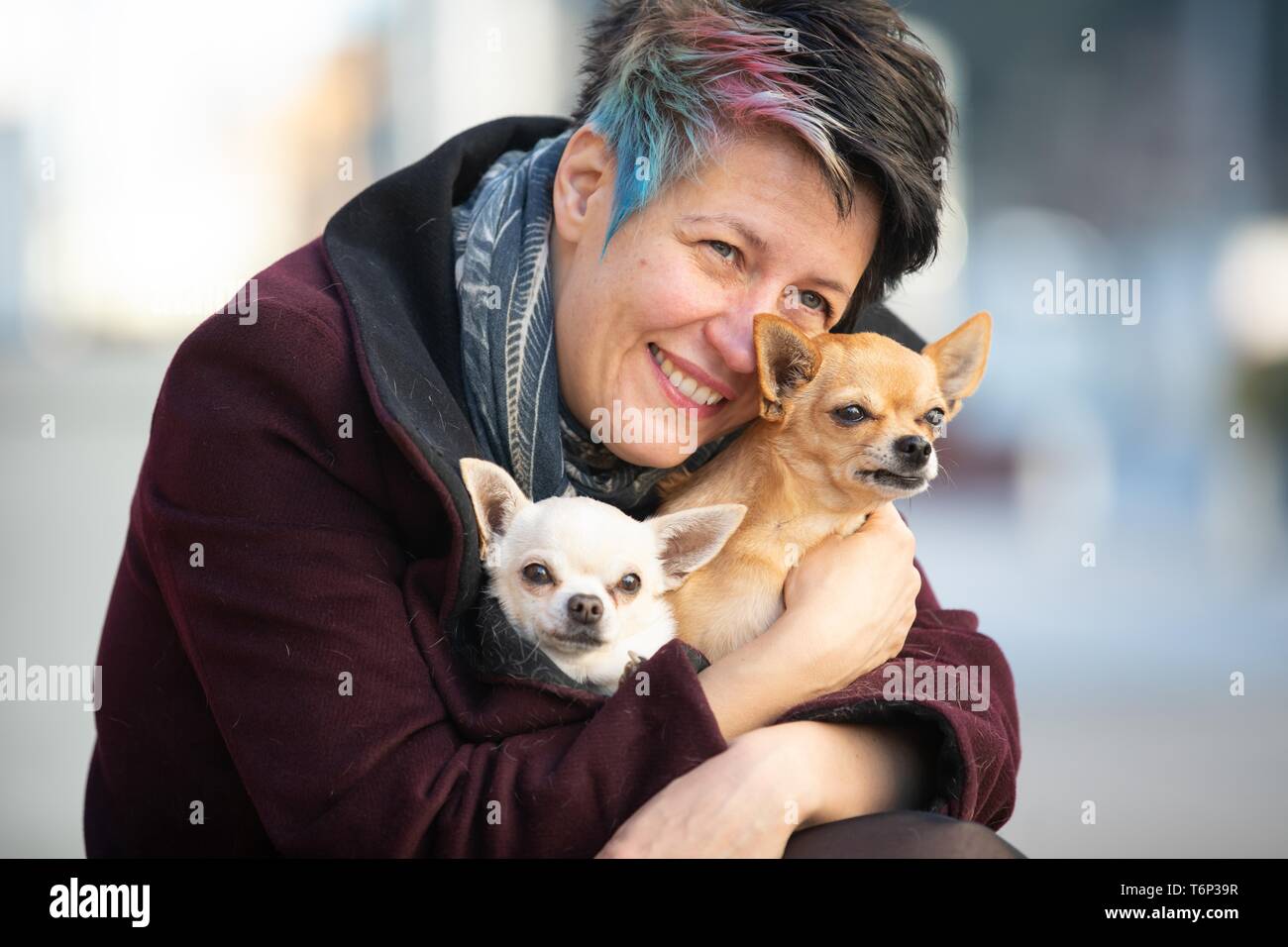 PORTRAIT OF A WOMAN AND HER TINY CHIHUAHUA IN GERA, GERMANY