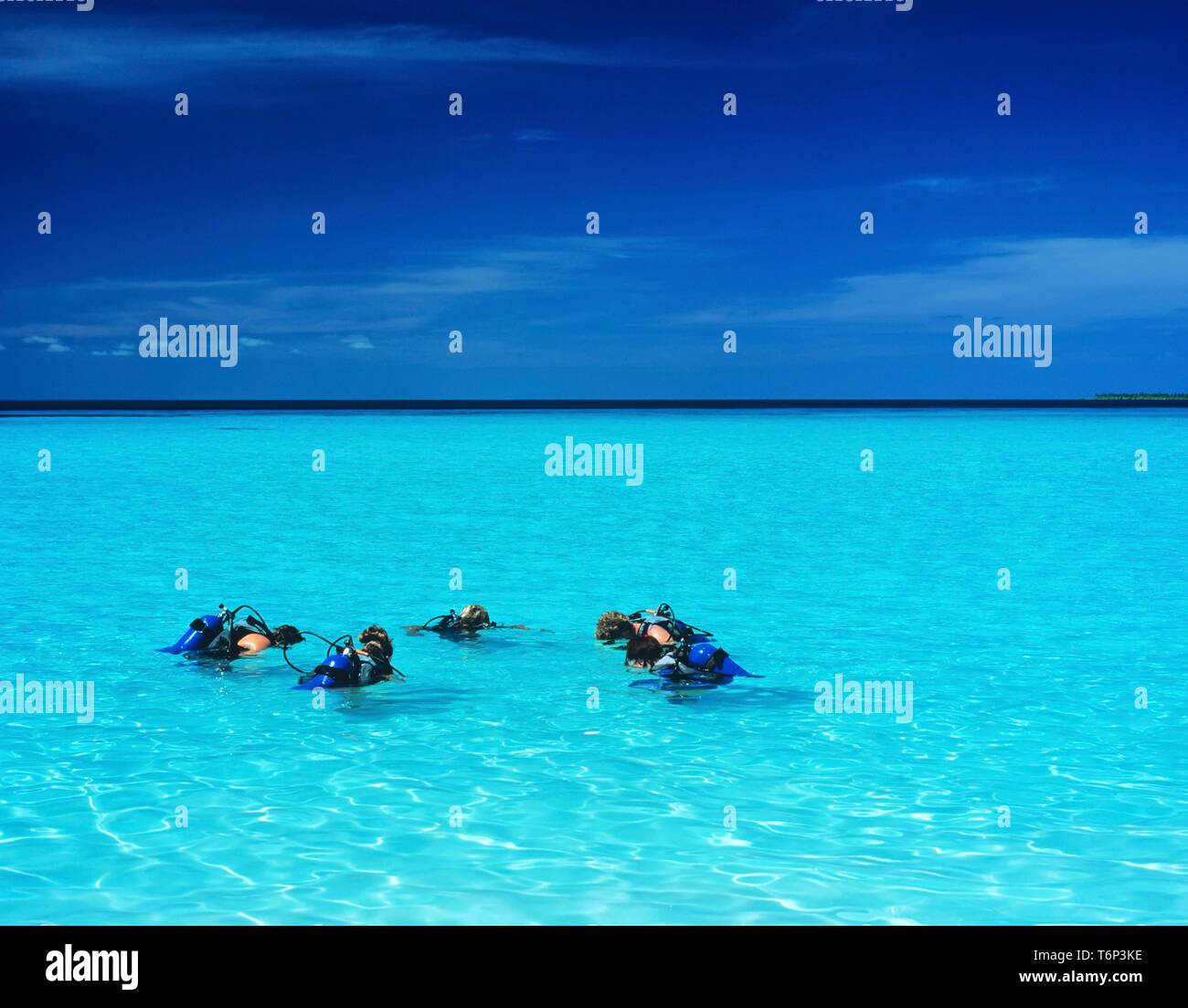 Tourists taking a scuba diving course, Maledives, Indian Ocean Stock Photo