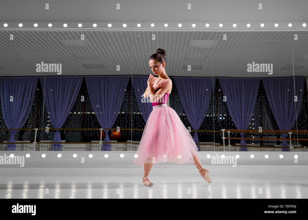 Young ballerina in training hall Stock Photo
