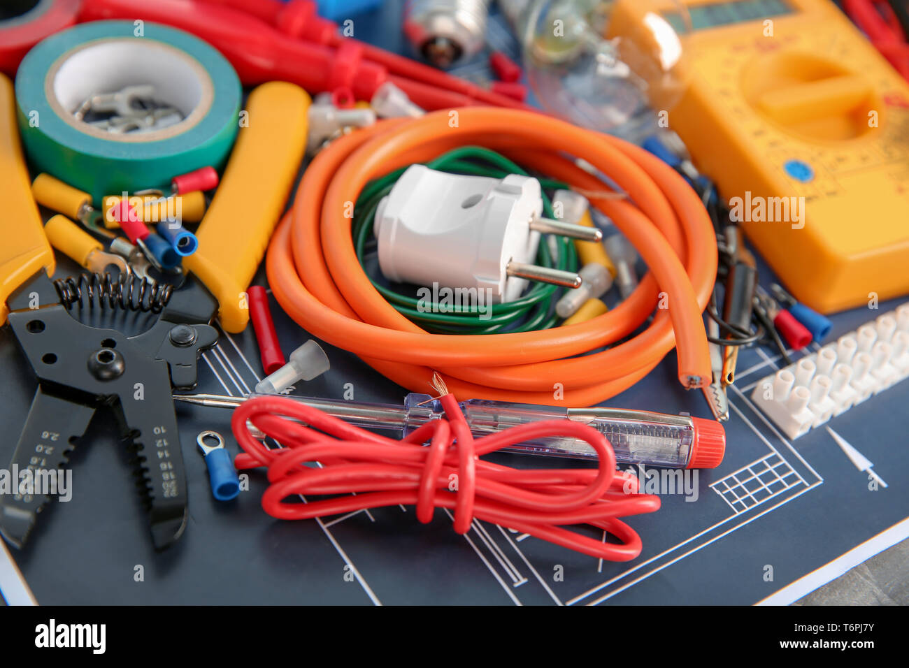 Different electrical tools on house plan Stock Photo - Alamy