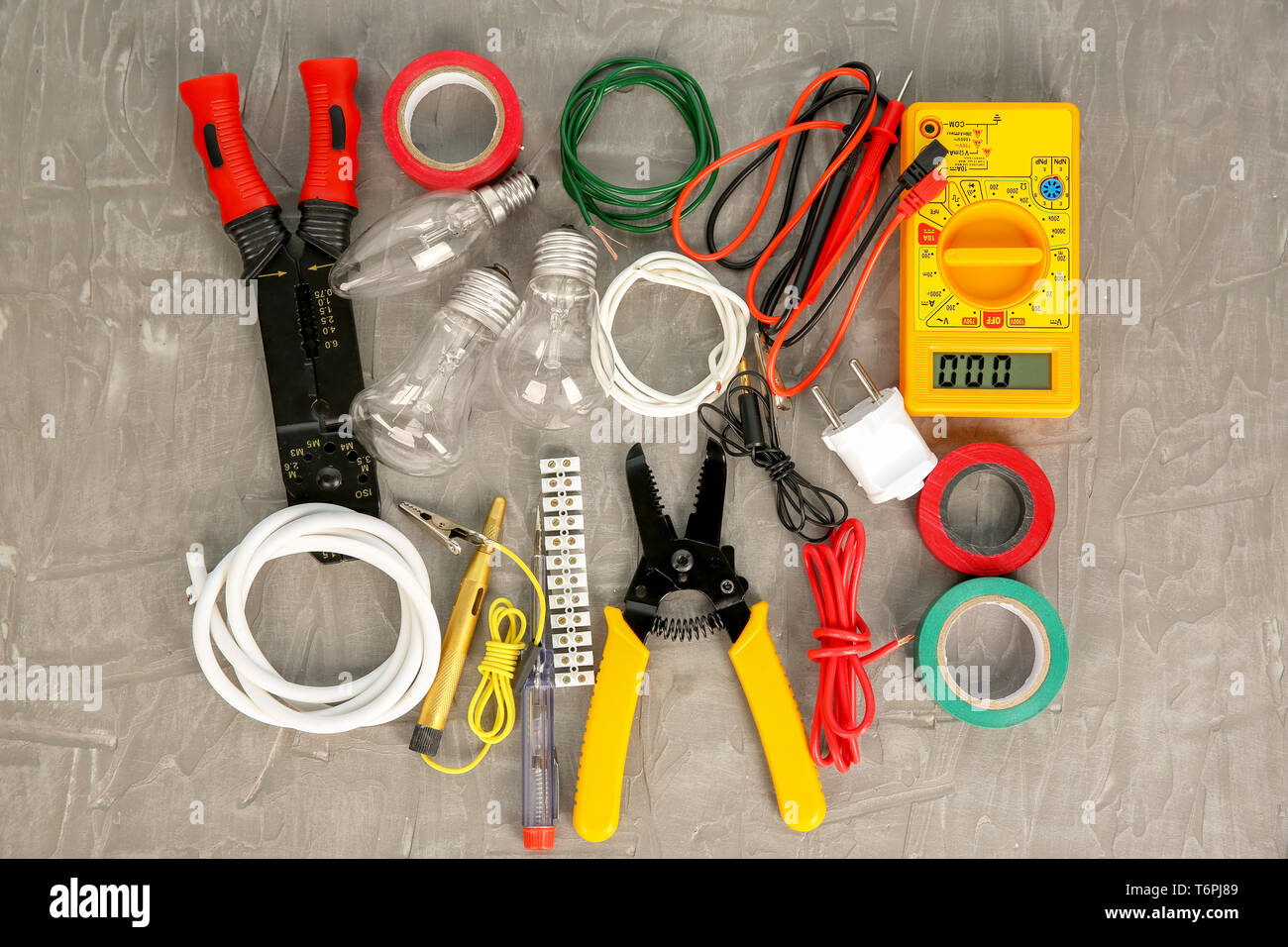 Flat lay composition with electrical tools on grey background Stock Photo