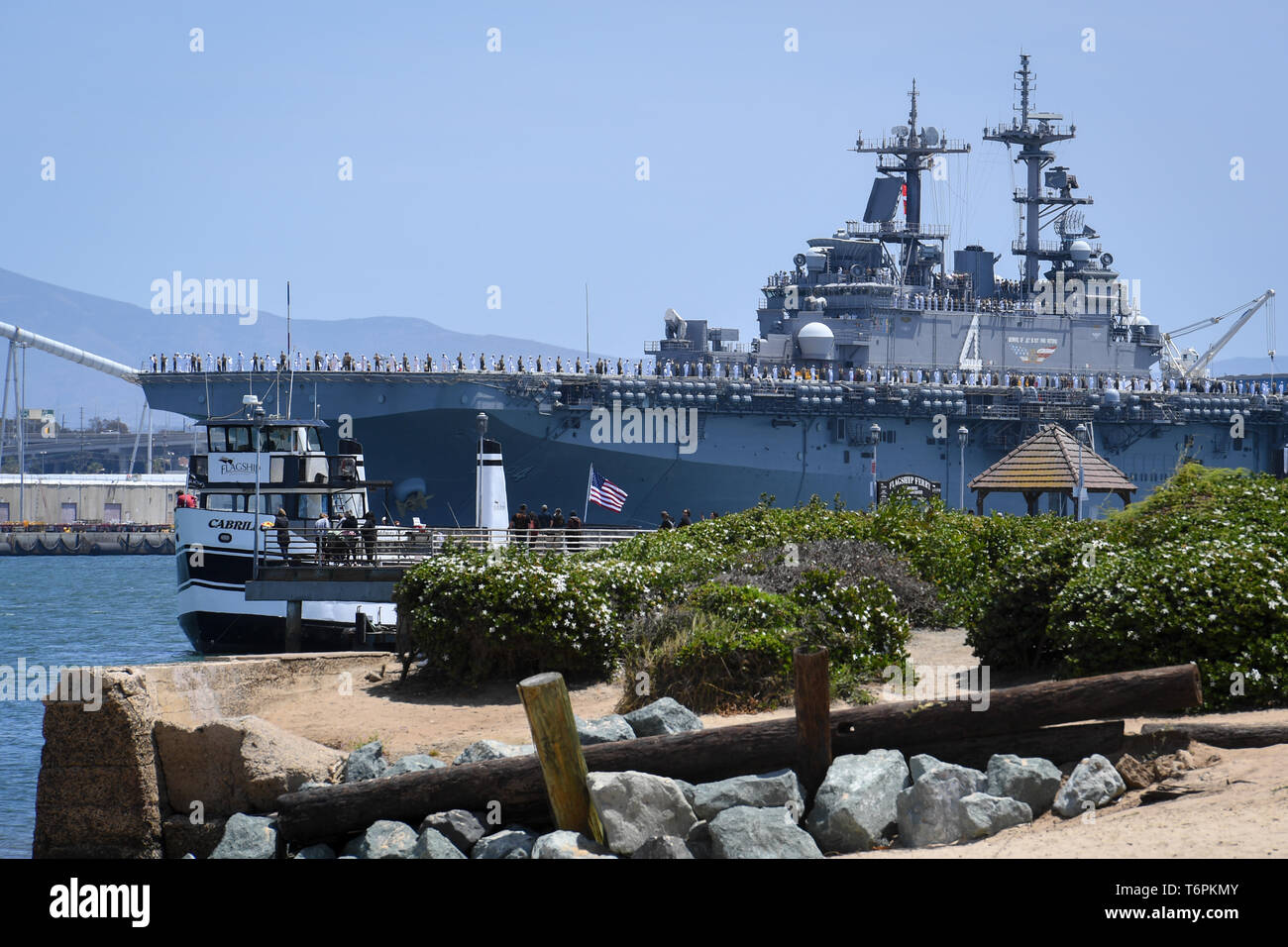 190501-N-SB299-1010    SAN DIEGO (May 1, 2019) – Sailors and Marines aboard the amphibious assault ship USS Boxer (LHD 4) depart Naval Base San Diego, May 1, for a regularly-scheduled deployment. Boxer is the flagship of the Boxer ARG, which also includes the amphibious transport dock USS John P Murtha (LPD 26) and the amphibious dock landing ship USS Harpers Ferry (LSD 49), as well as the 11th Marine Expeditionary Unit (MEU). The ARG/MEU team will conduct maritime security operations, crisis response operations, theater security cooperation and forward naval presence operations while deployed Stock Photo