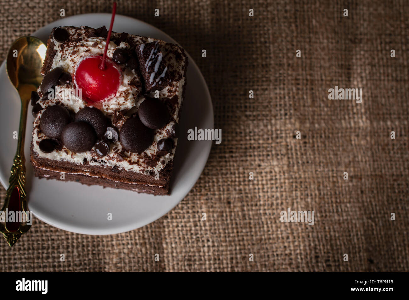 Black Forest Cake Topping Cherry Chocolate And Spoon Colour Gold Putting On The White Plate On The Sack Bags Background Stock Photo Alamy Black Forest Cake Topping Cherry Chocolate And Spoon Colour Gold Putting On The White Plate On The Sack Bags Background Stock Photo Alamy