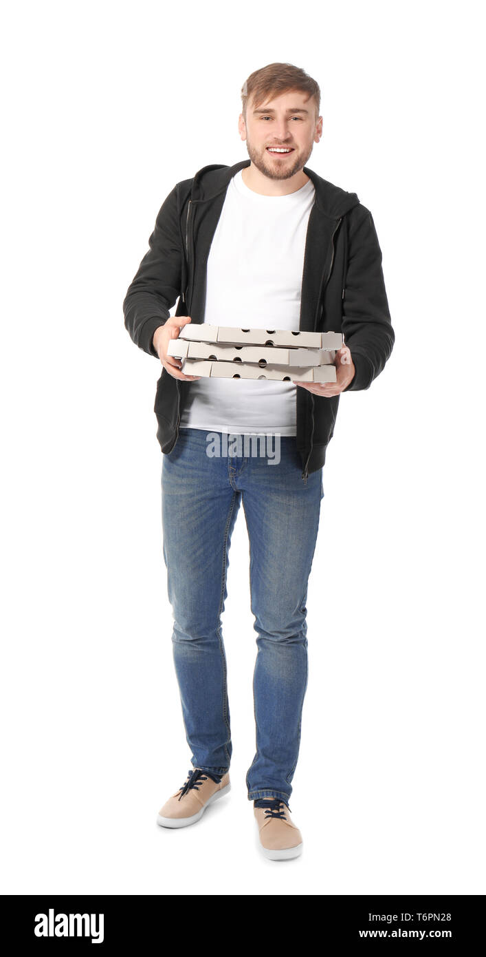 Young man with cardboard pizza boxes on white background. Food delivery service Stock Photo