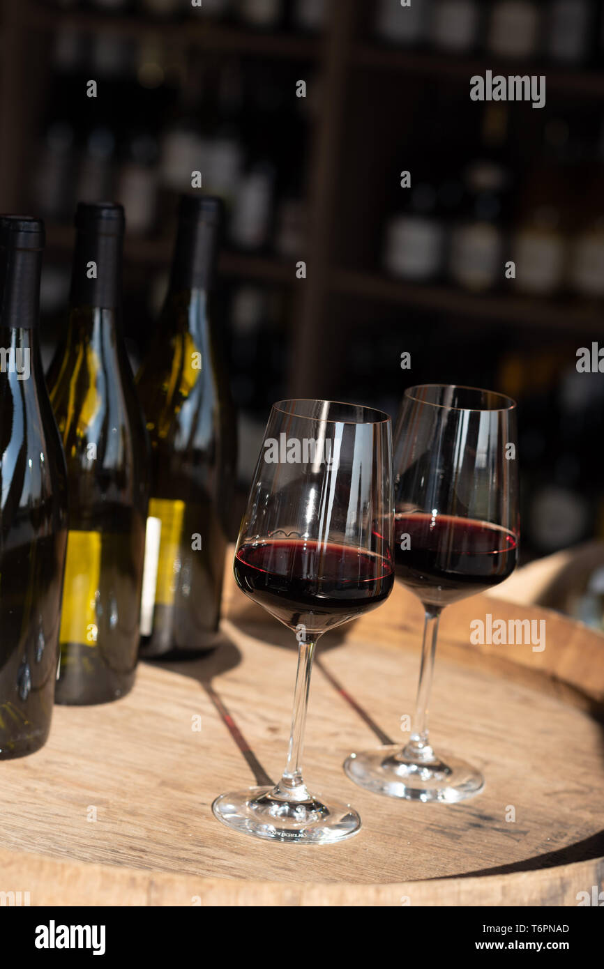 Two glasses of red wine on a cask *** Local Caption *** Stock Photo