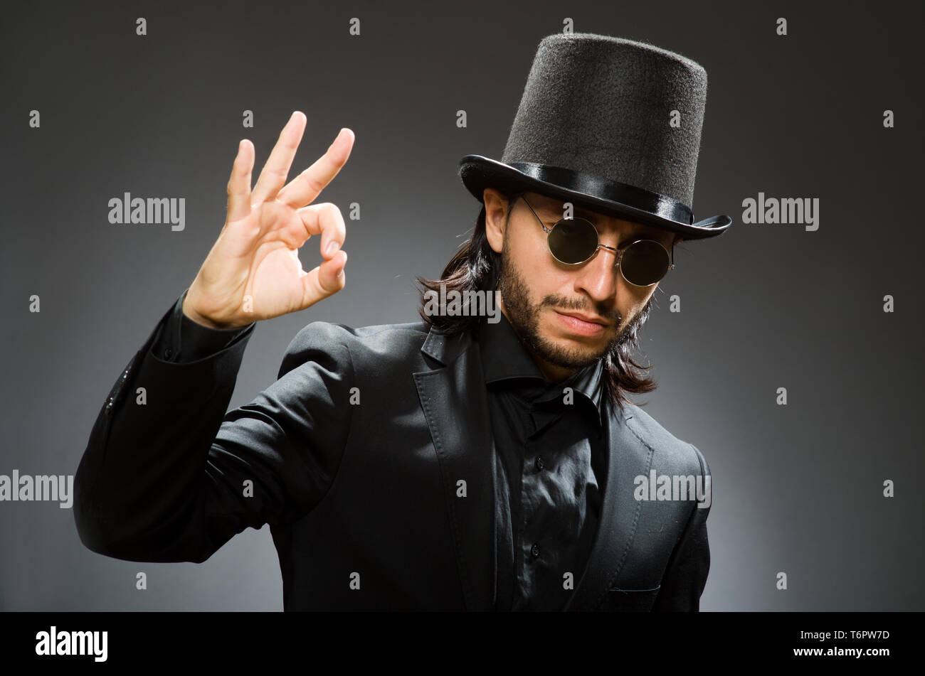 Vintage concept with man wearing black top hat Stock Photo - Alamy