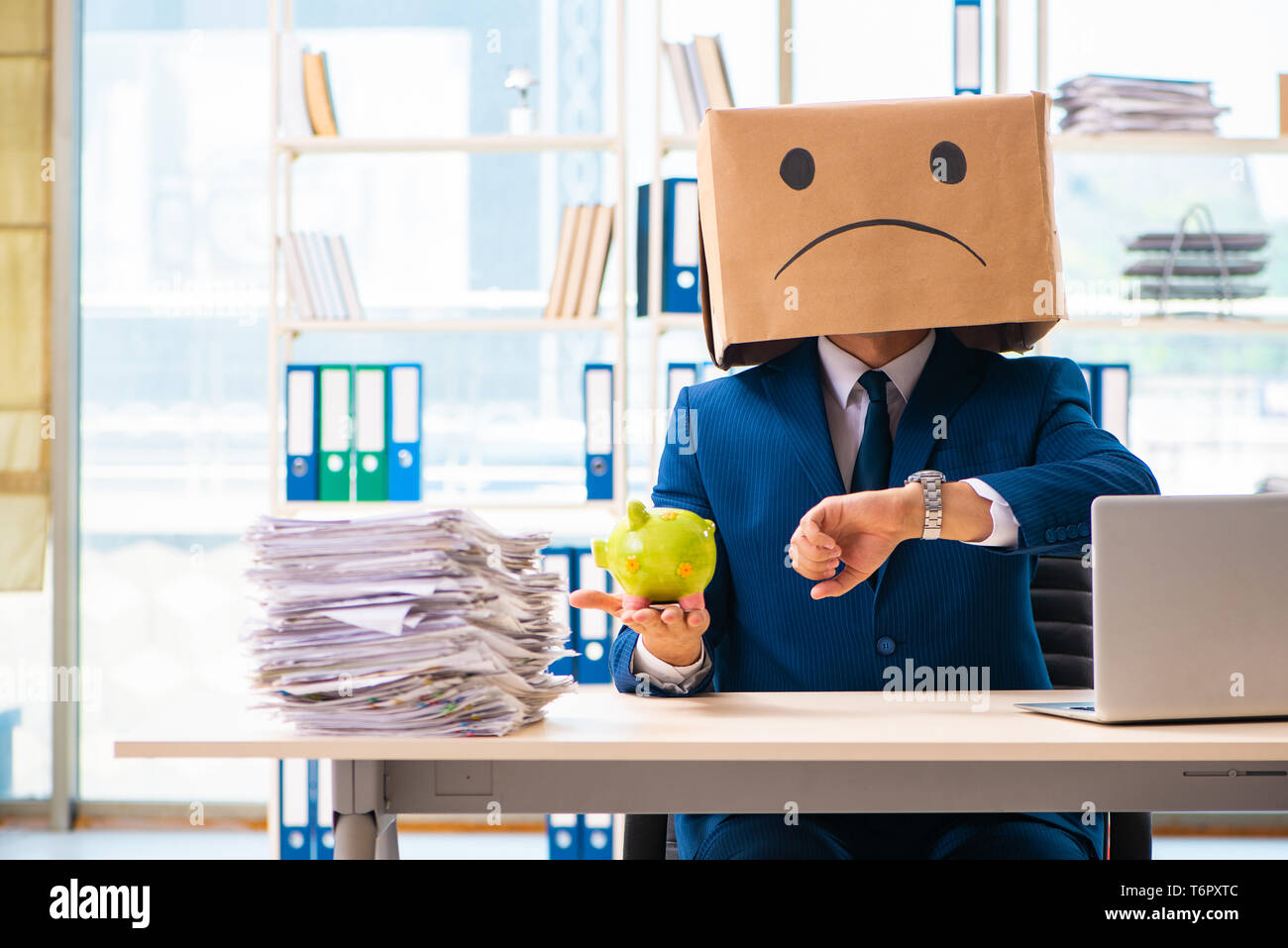 Unhappy man with box instead of his head Stock Photo