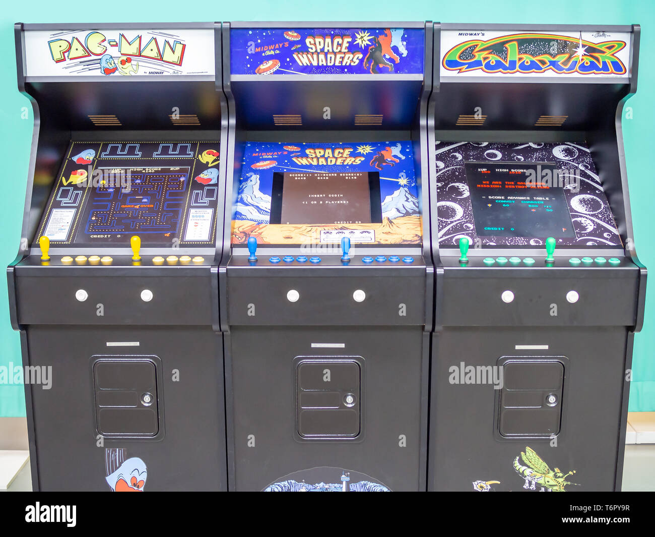 TERRASSA, SPAIN-MARCH 19, 2019: Pac-man, Space Invaders and Galaxian arcade/coin-op machine in the National Museum of Science and Technology of Catalo Stock Photo