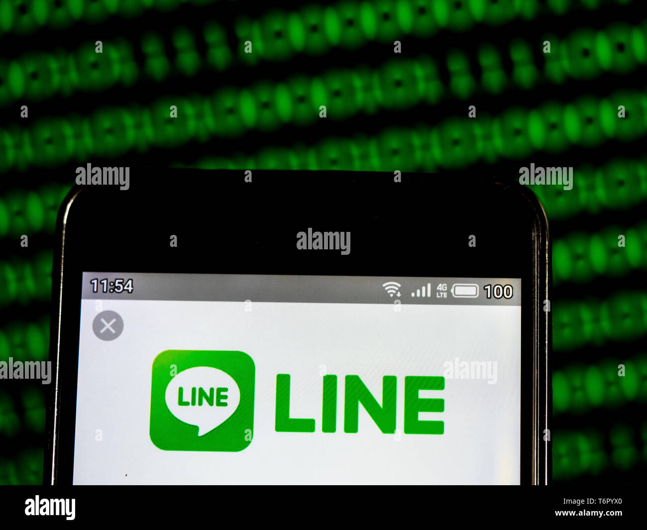 In this photo illustration a Line Corporation, Ltd. logo seen displayed ...