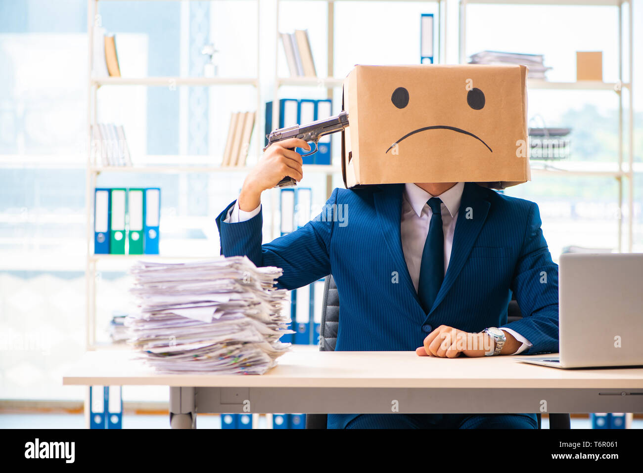 Unhappy man with box instead of his head Stock Photo