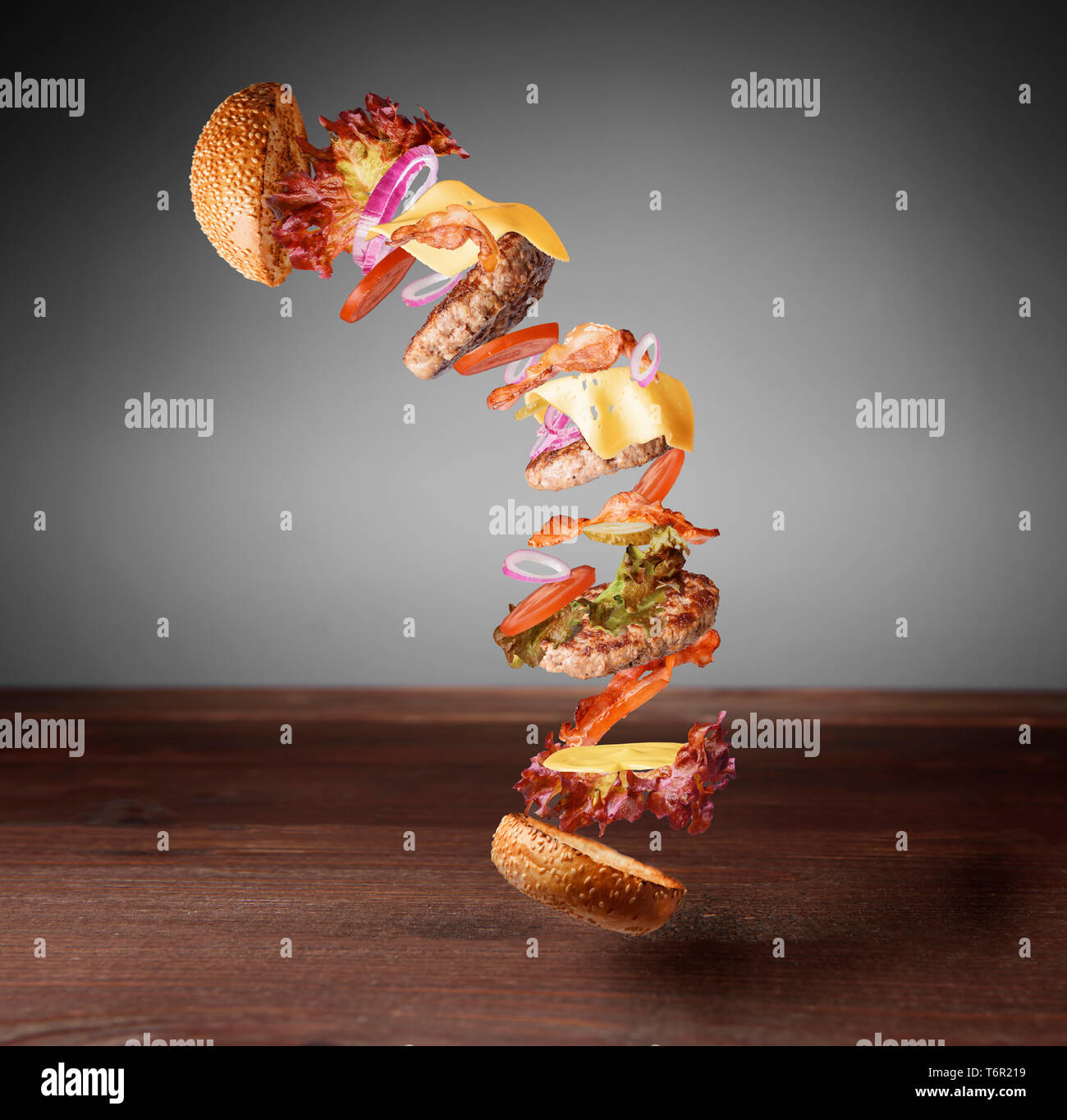 The exploding big burger with three succulent and tasty cutlets Stock ...