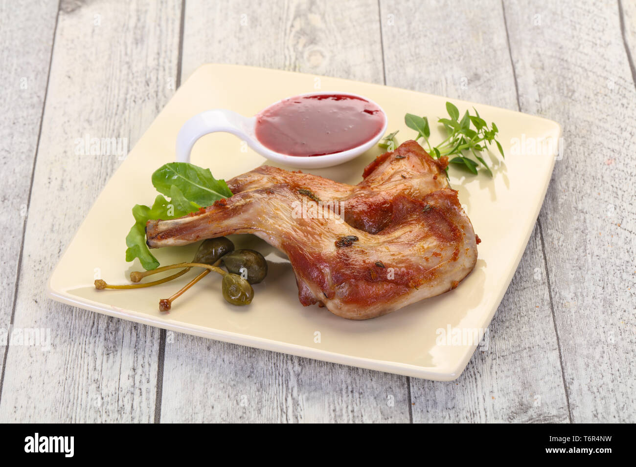 Robt Rabbit Leg Roasted rabbit legs with cowberry sauce Stock Photo - Alamy