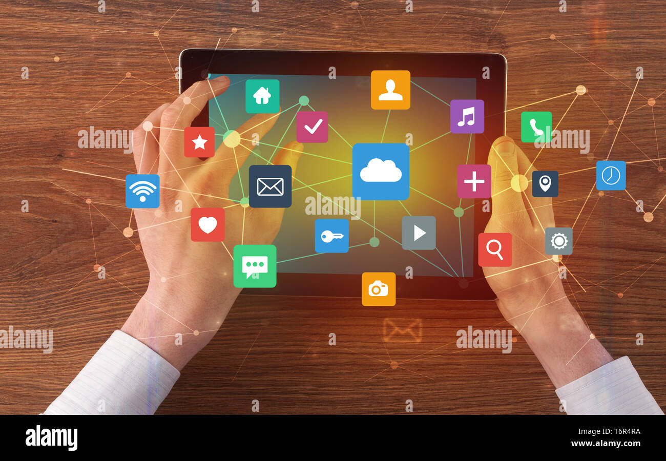 Hand touching multitask tablet with cloud wifi message social media ...
