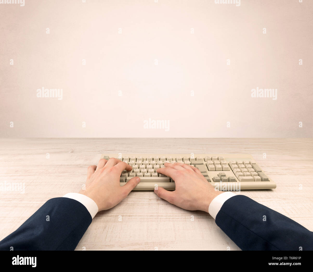 First person view of an elegant businessman hand  typing on light background  Stock Photo