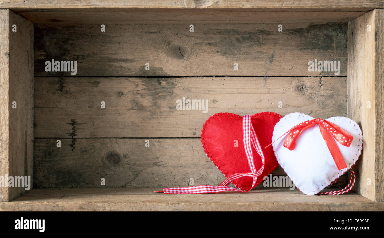 felt hearts on a wooden background Stock Photo
