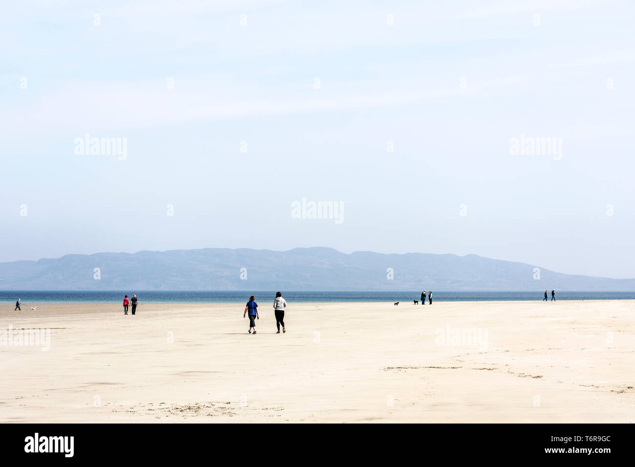 People on a beach walking, County Donegal, Ireland Stock Photo