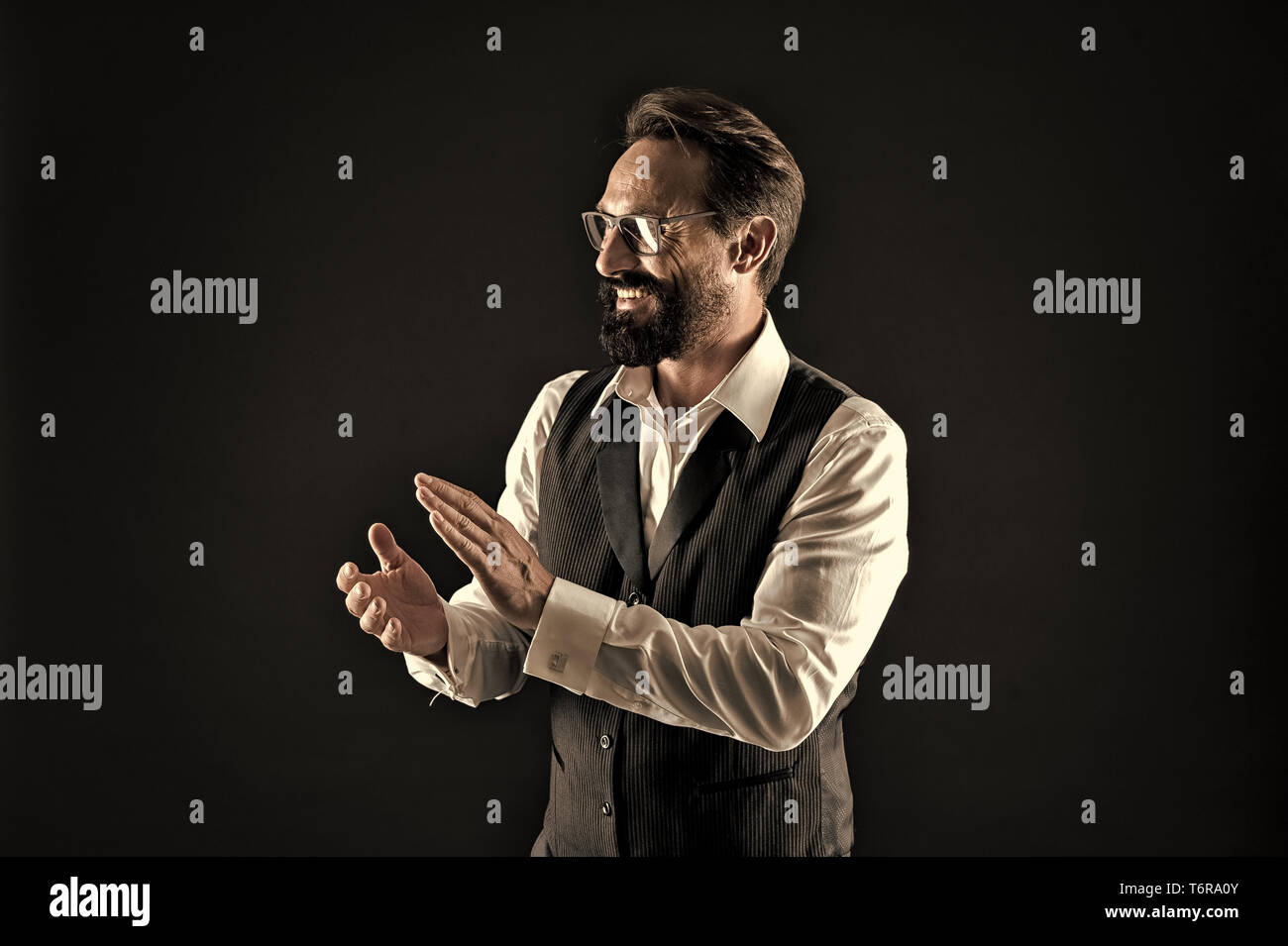 Bravo applause. Man well groomed elegant formal suit clap hands approving something black background. Businessman excited about business project applause. Loud applause to genius business speaker. Stock Photo