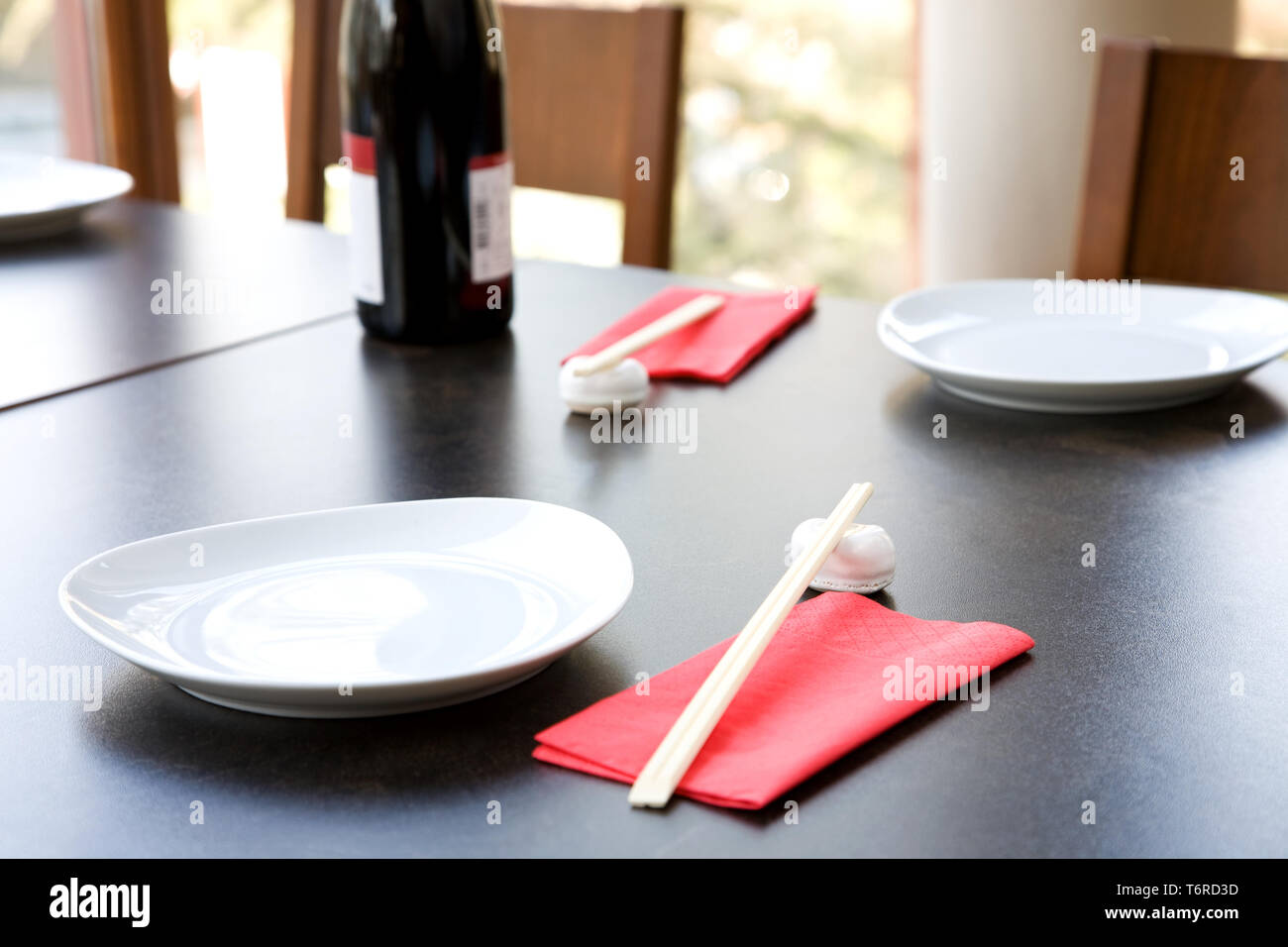 restaurant interior with wine bottle and chopsticks, shallow dof Stock Photo Alamy