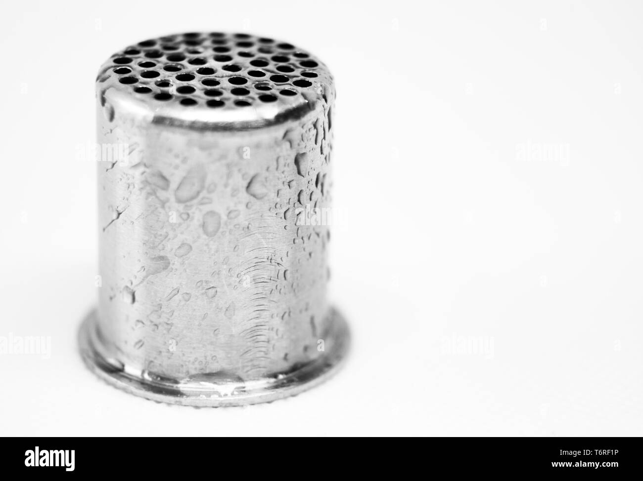 part of garlic press with water splashes Stock Photo Alamy
