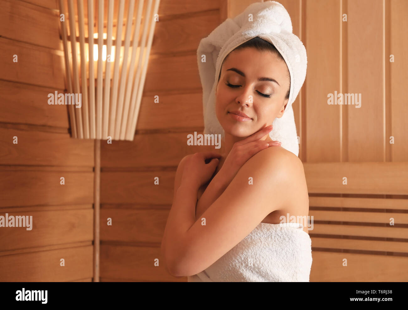 https://c8.alamy.com/comp/T6RJ38/young-woman-relaxing-in-sauna-T6RJ38.jpg